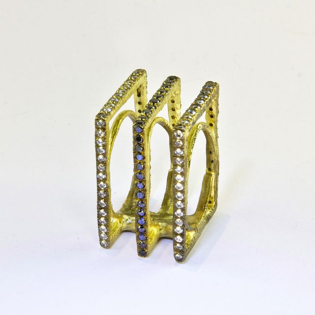 gold jewel with stones
