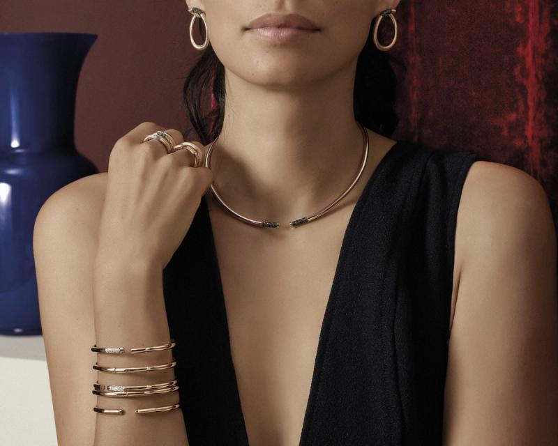 model with set of earrings, necklace, bracelet and rings