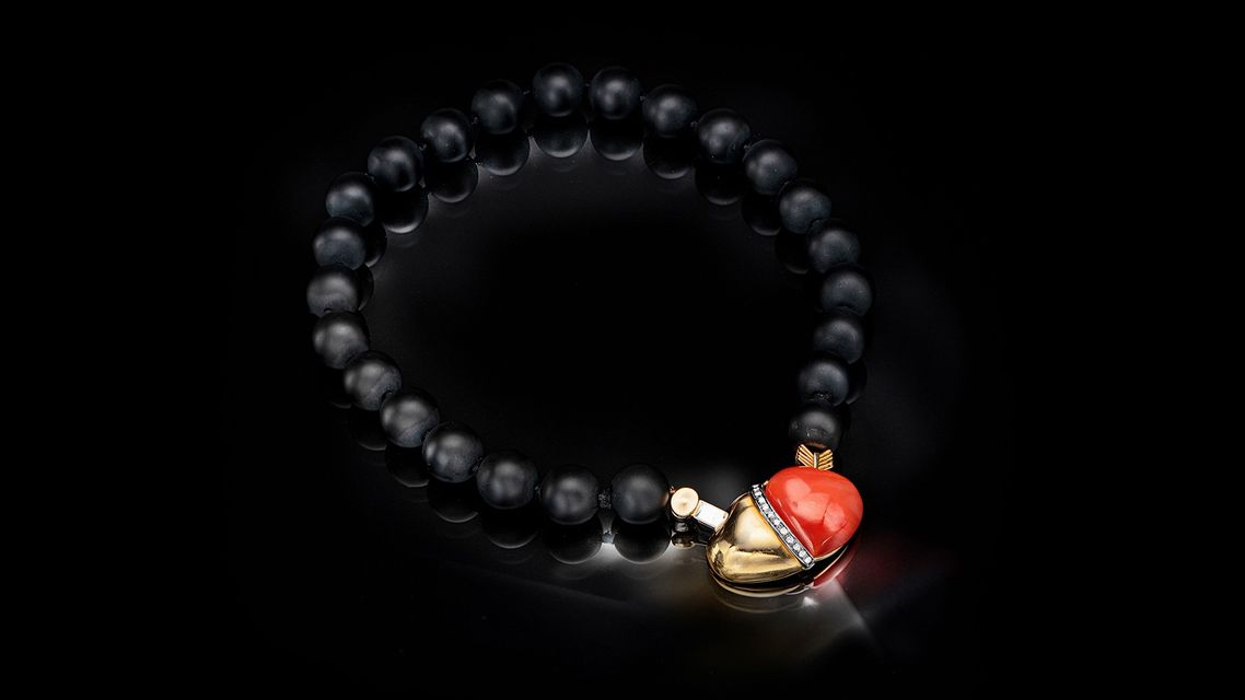 black necklace with red coral pendant