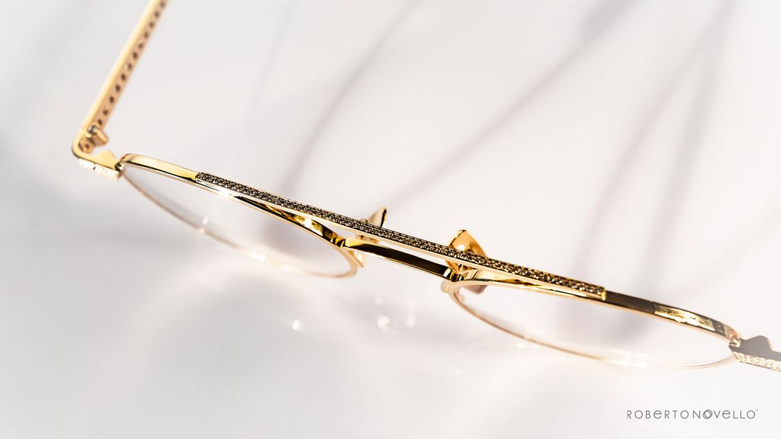 precious stones on golden glasses