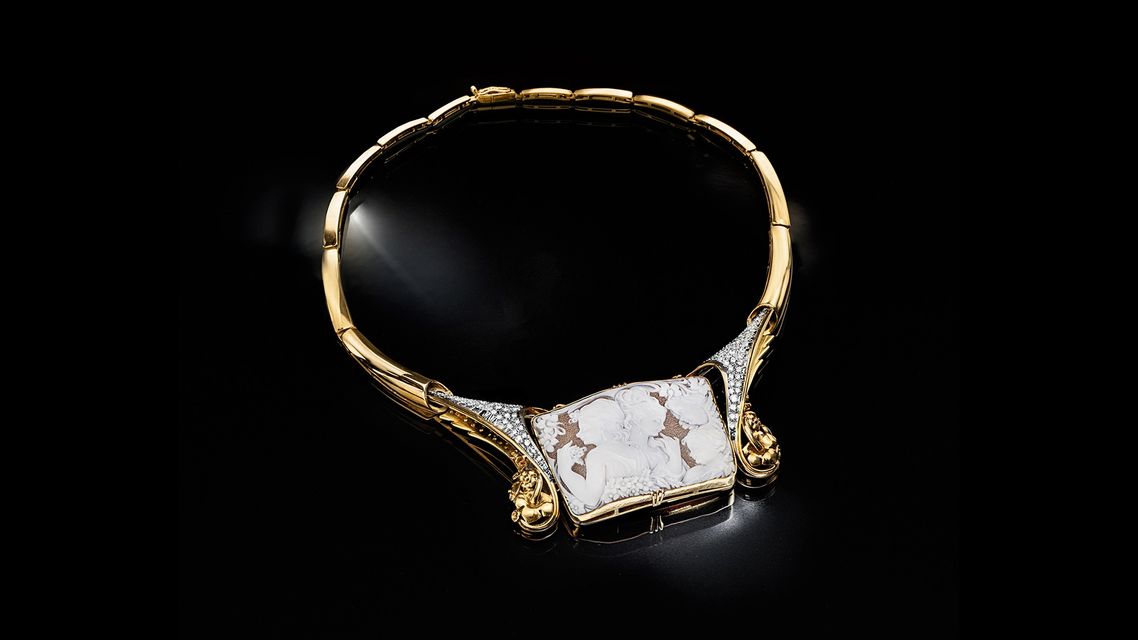 gold cammeo necklace with precious stones