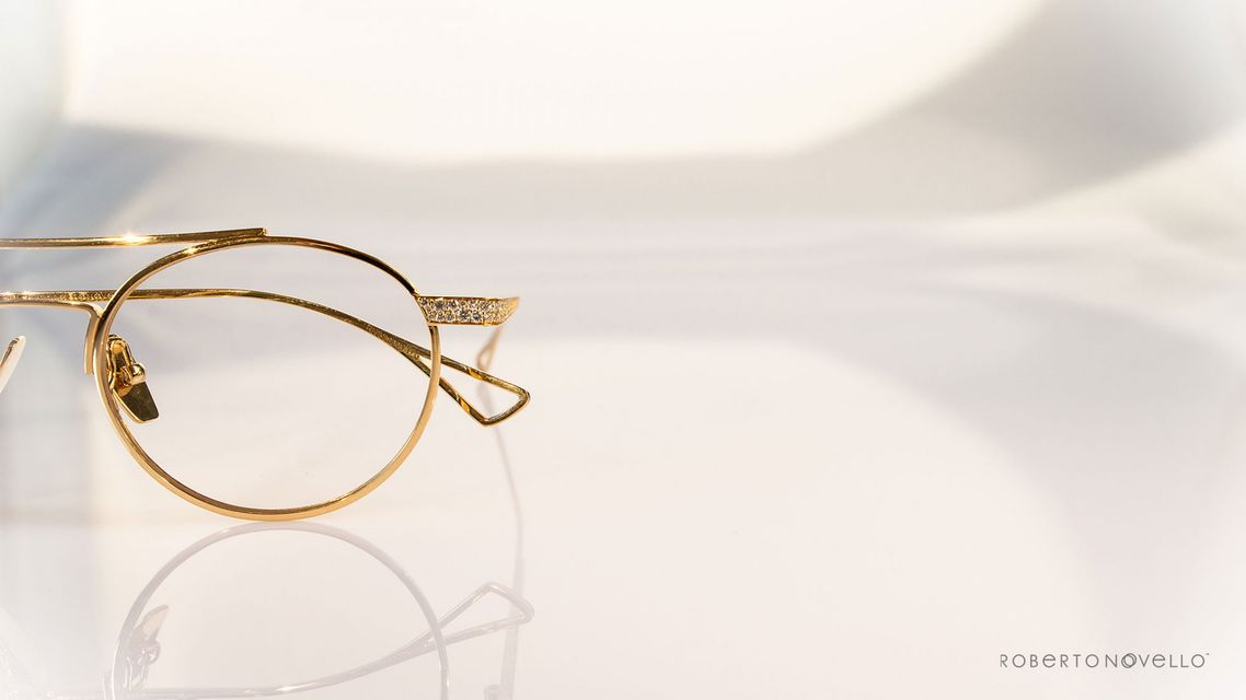 detail of precious stones on golden glasses