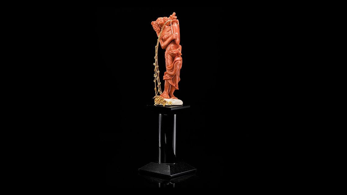 red coral aquarium statuette with golden details