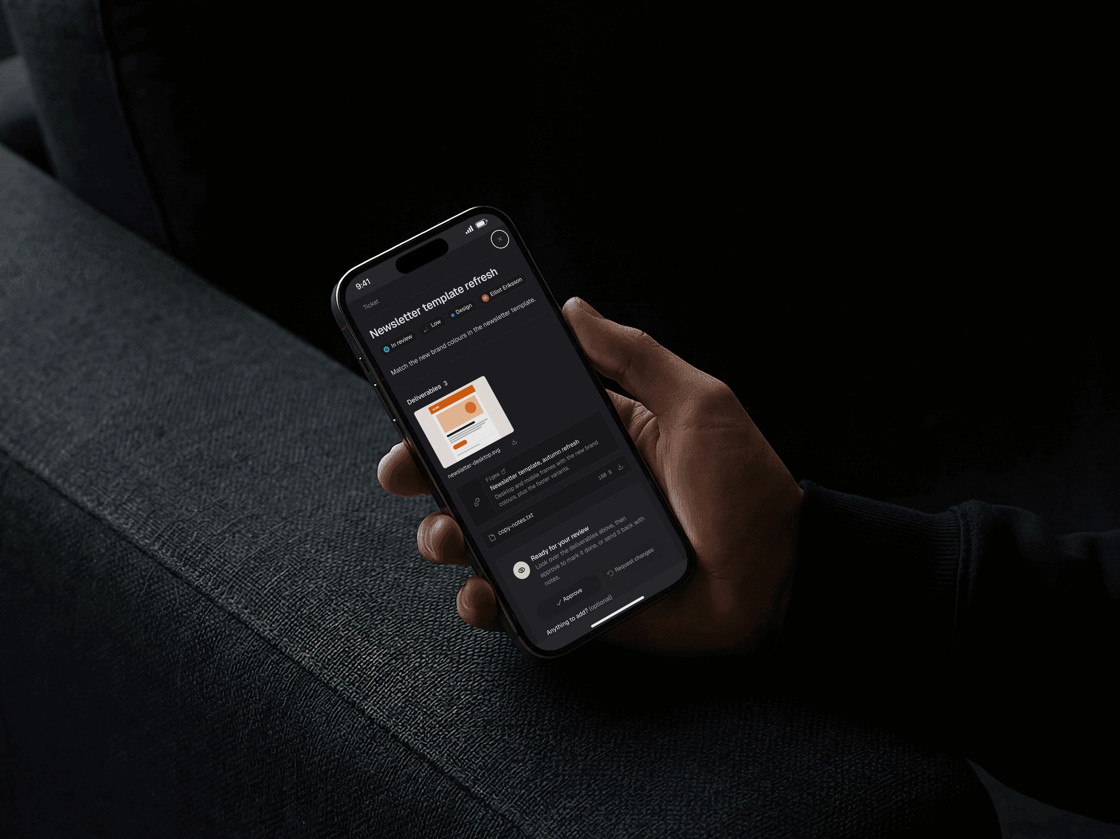 A client reviewing a delivery in Knegt on a phone held in a dark room