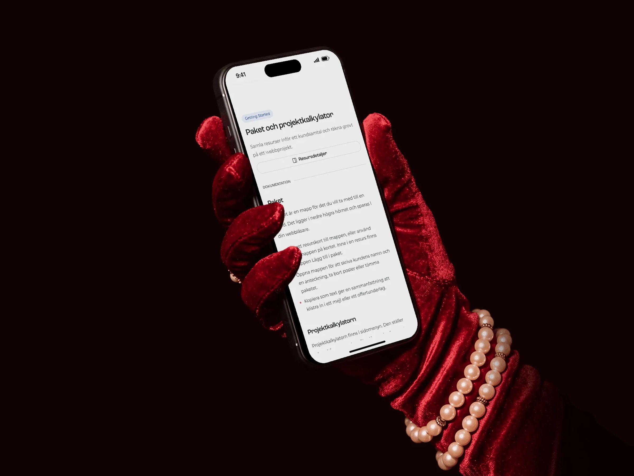 The package and project calculator page on an iPhone held in a red velvet glove