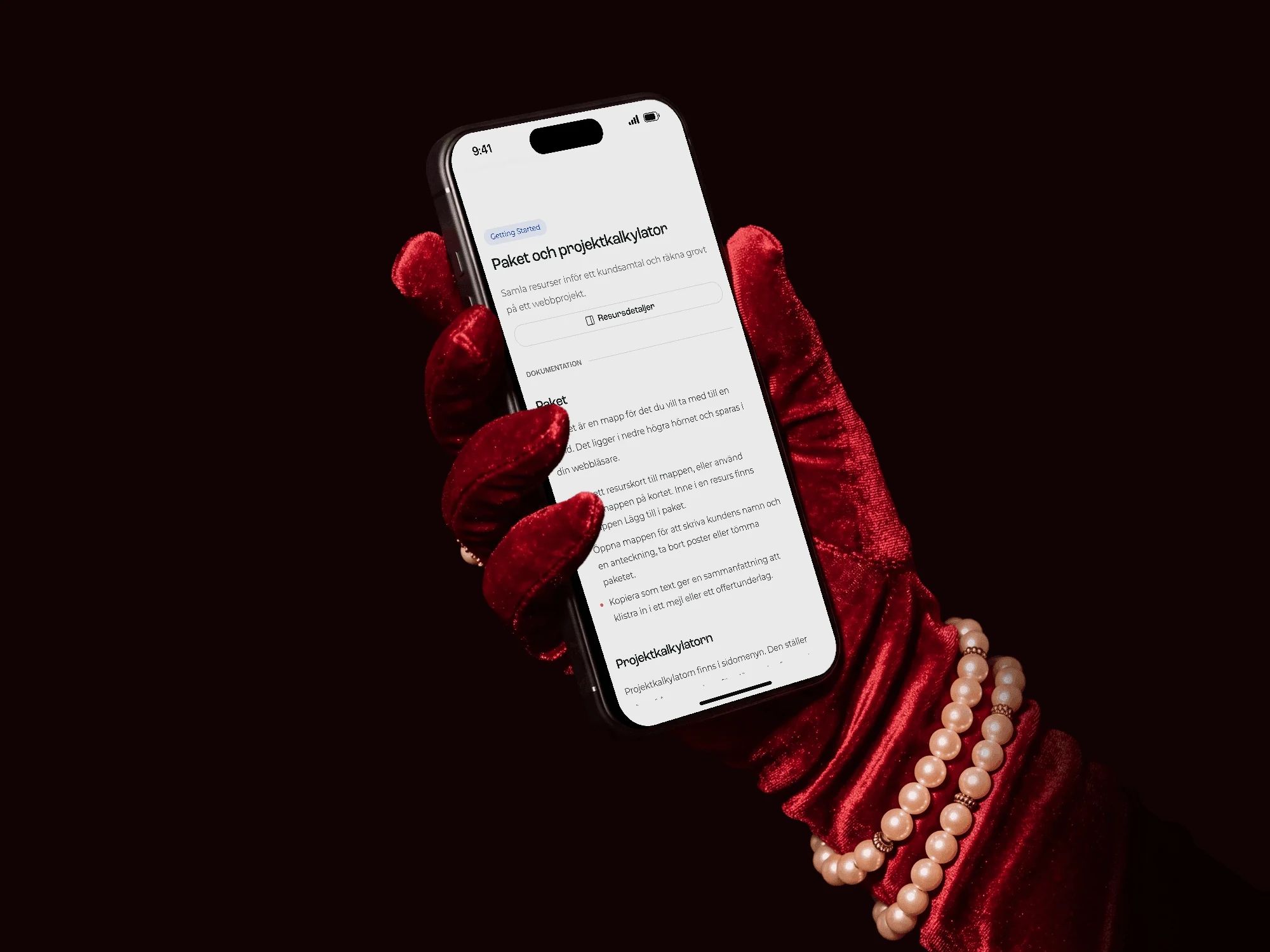 The package and project calculator page on an iPhone held in a red velvet glove
