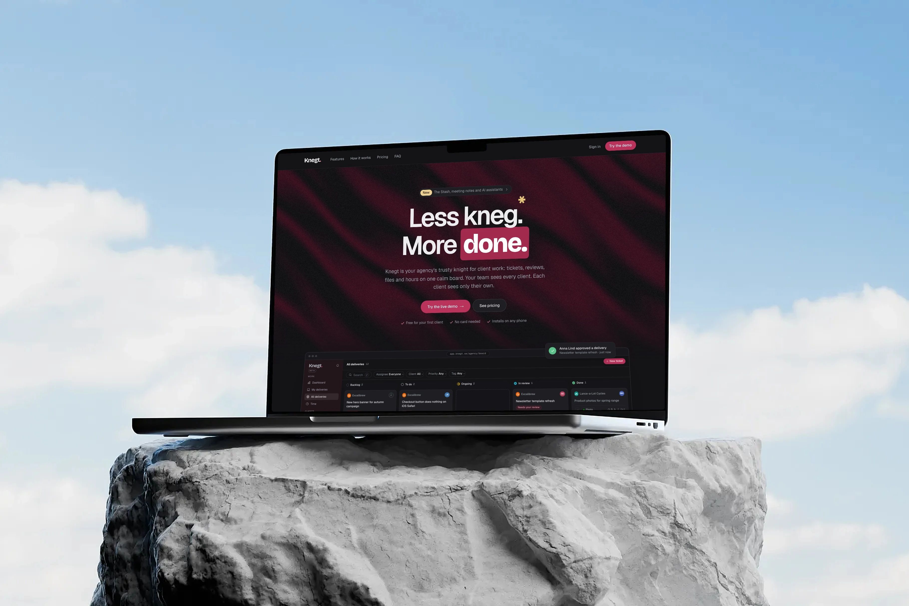 Knegt's landing page on a MacBook resting on a rock under a blue sky