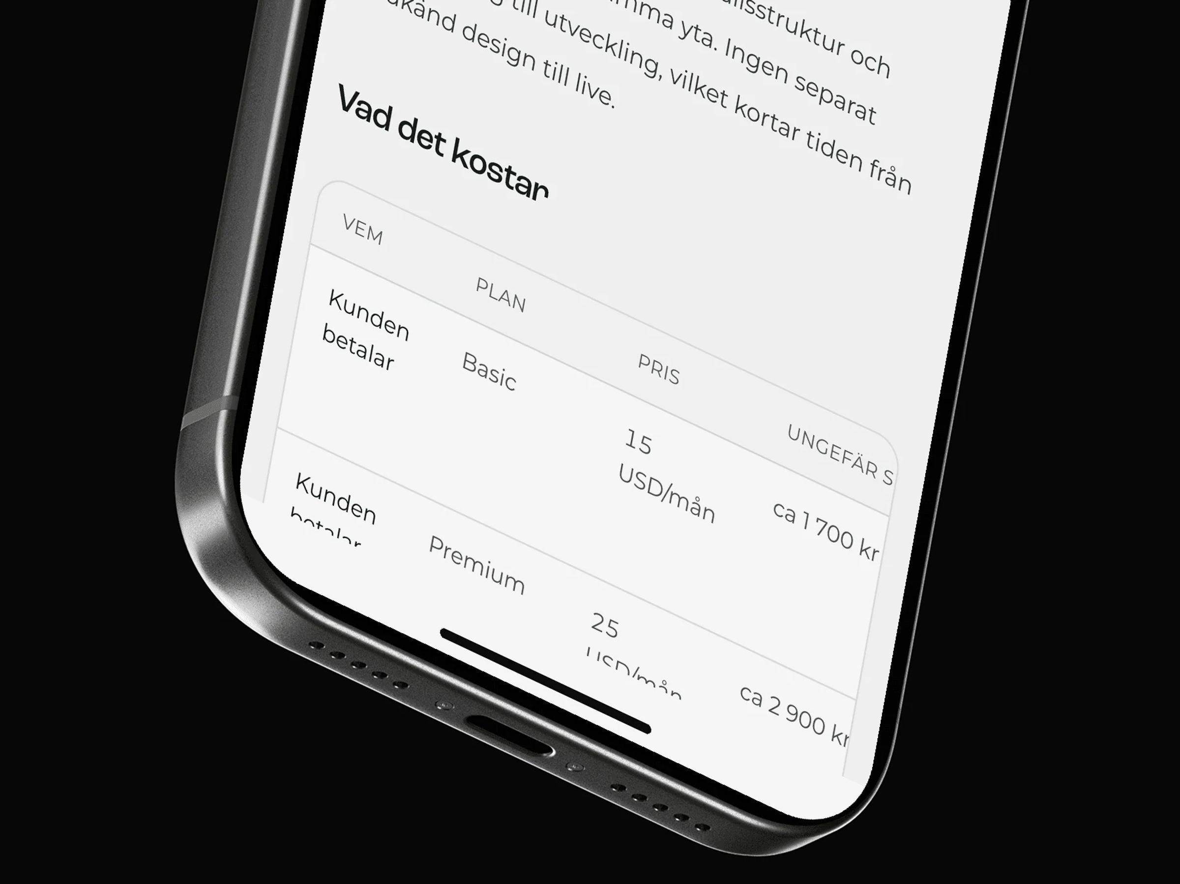 Close-up of an iPhone showing the Webflow page's pricing table