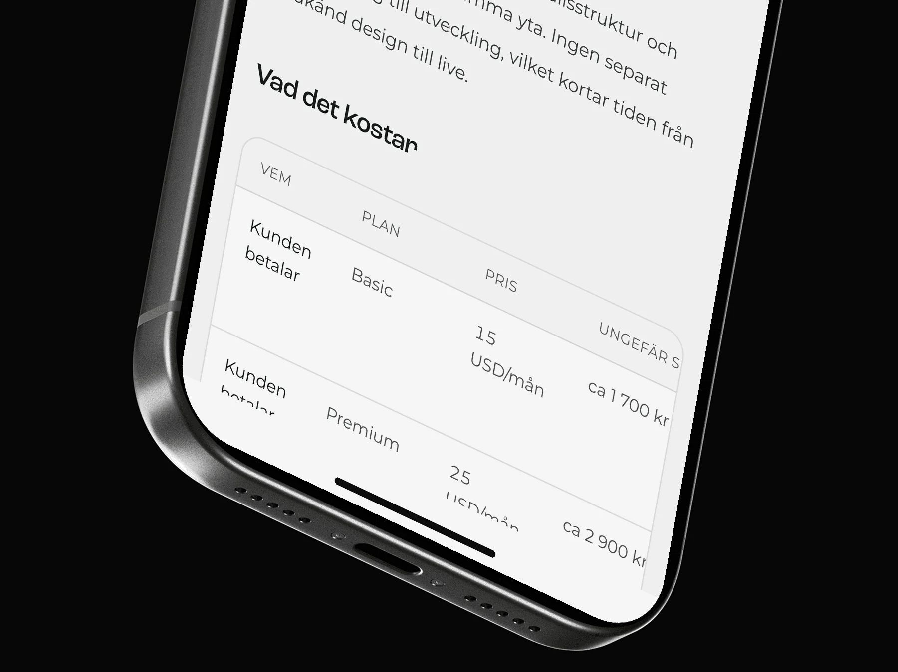 Close-up of an iPhone showing the Webflow page's pricing table