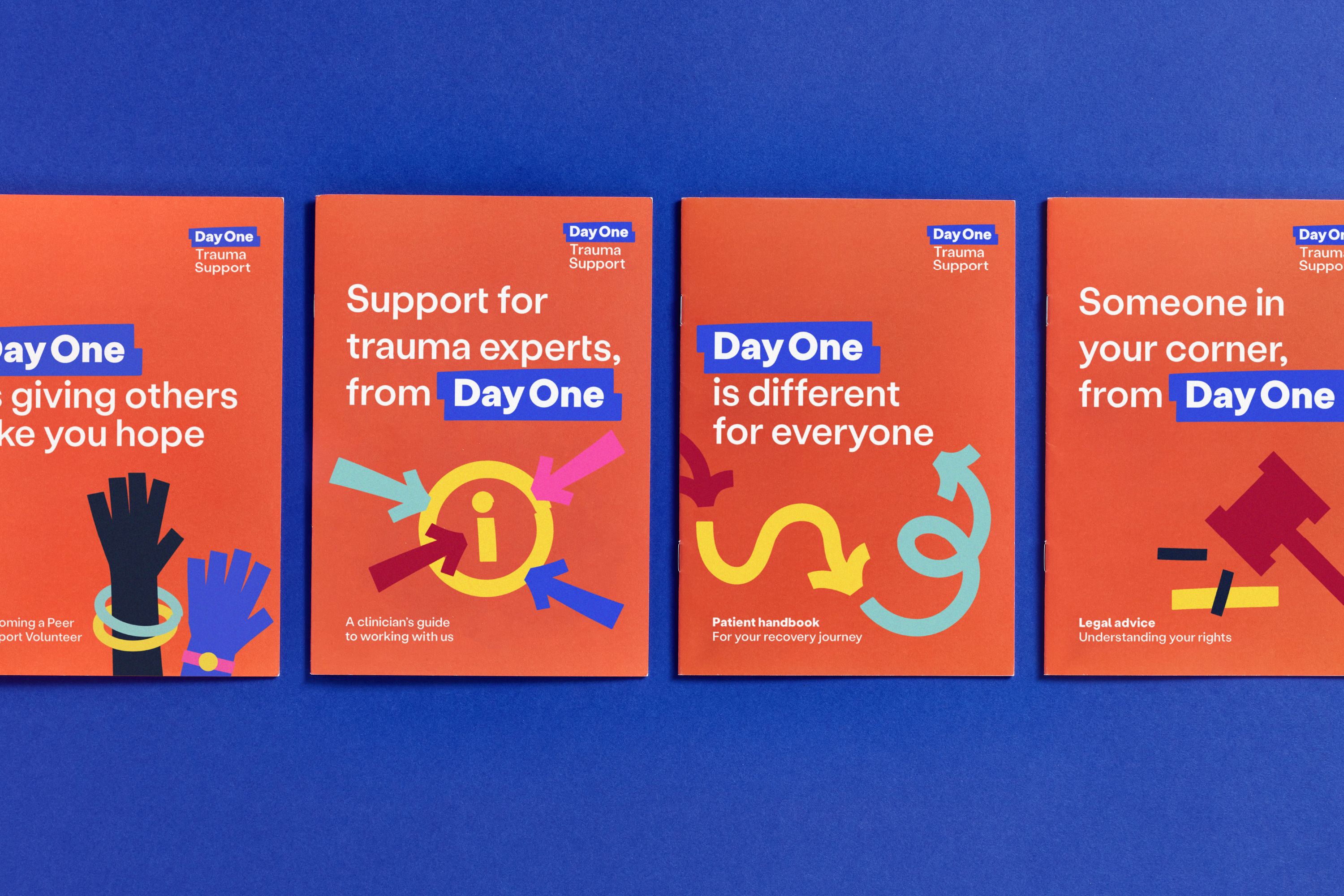 Three booklets for day one are seen on a dark blue background, with the two on either ends of the middle one being cut off by the framing