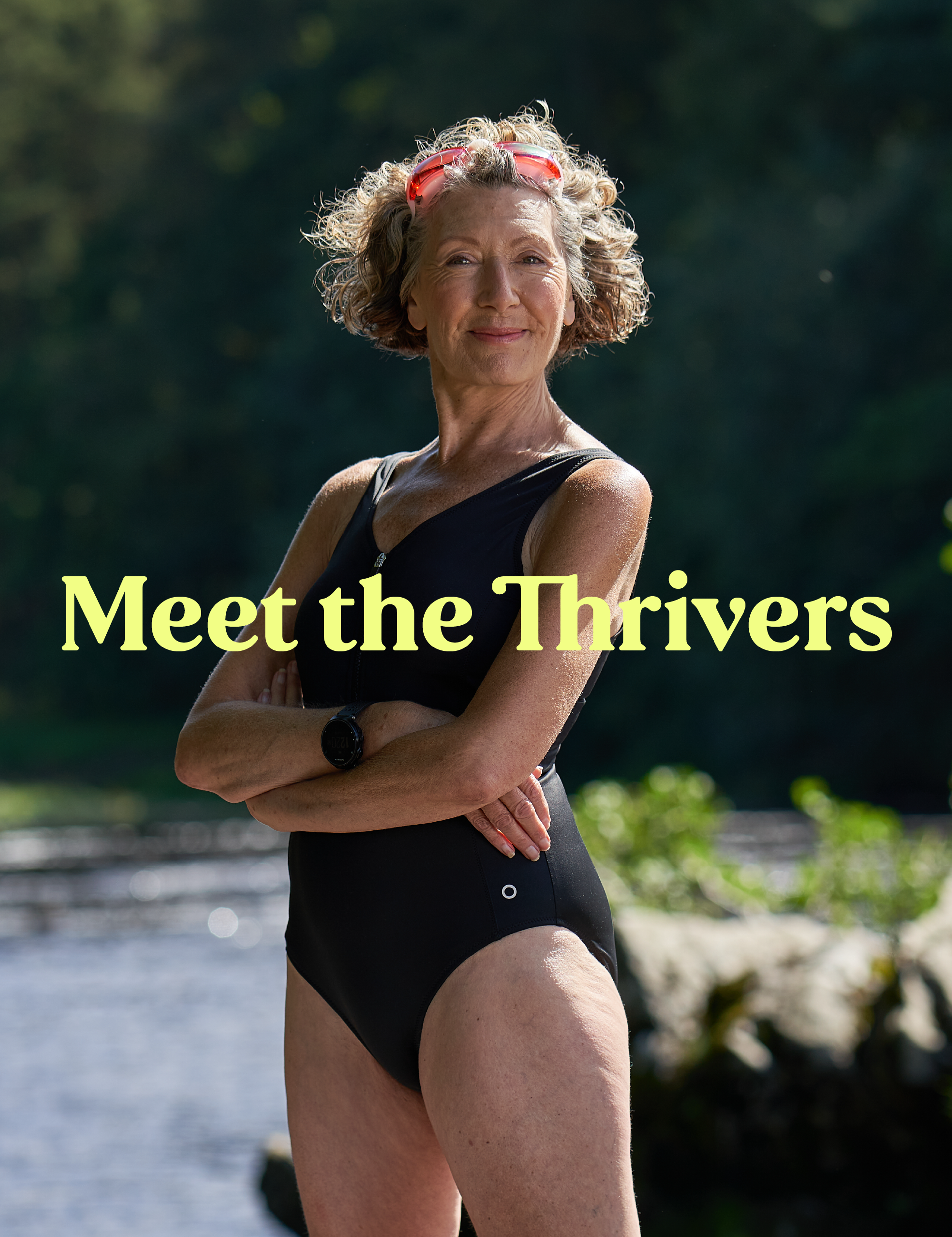 An elderly woman stands proudly river side in her swimming costume, with pink goggle strapped to her head. Light yellow text run across her saying "Meet the Thrivers"