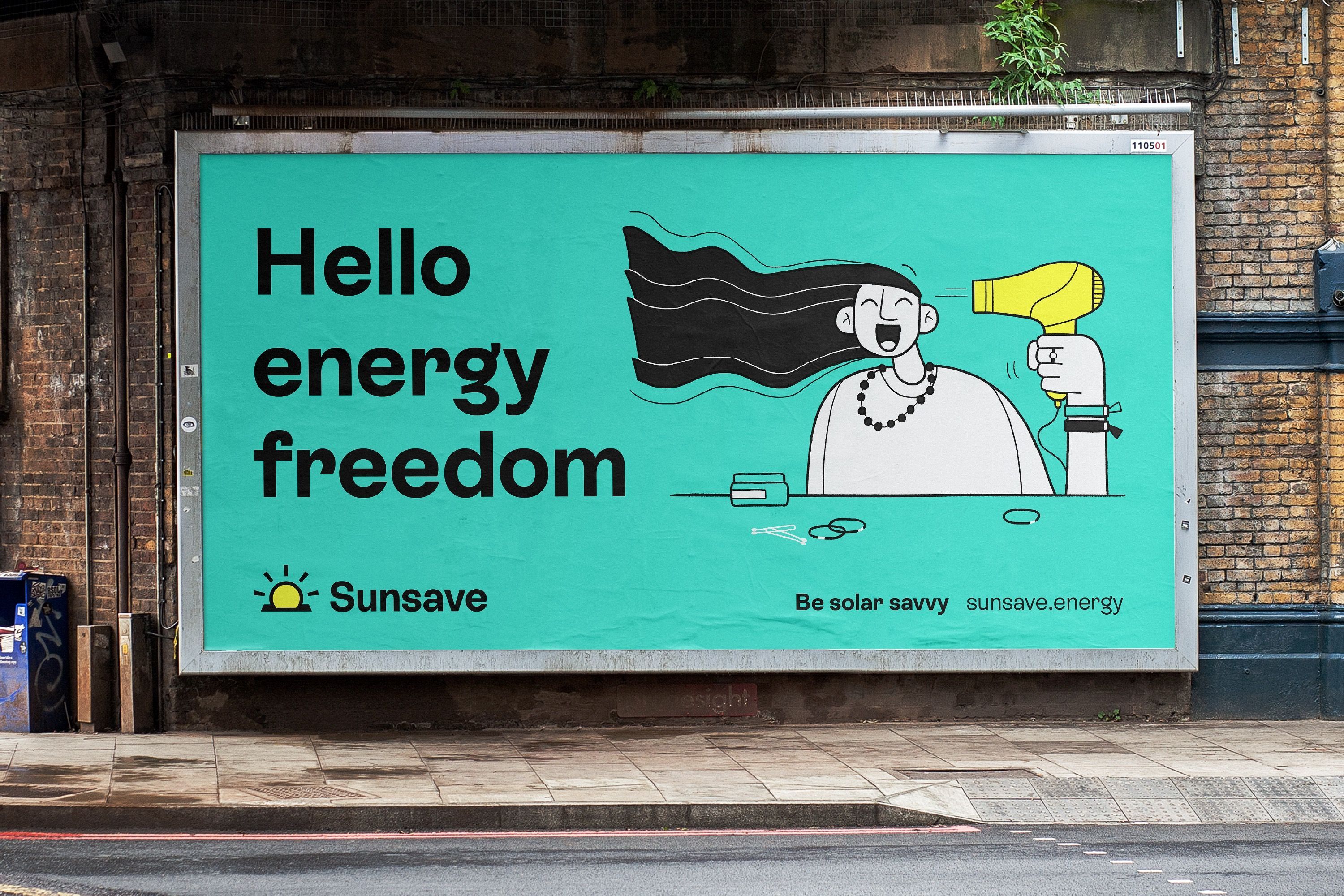 Billboard advert for the brand SunSave is displayed next to the side of a road. The copy on screen reads “Hello energy freedom” and features a filled line illustration of a character who is drying their hair with a yellow hairdryer. The text and illustration is set on a teal background within the billoard frame