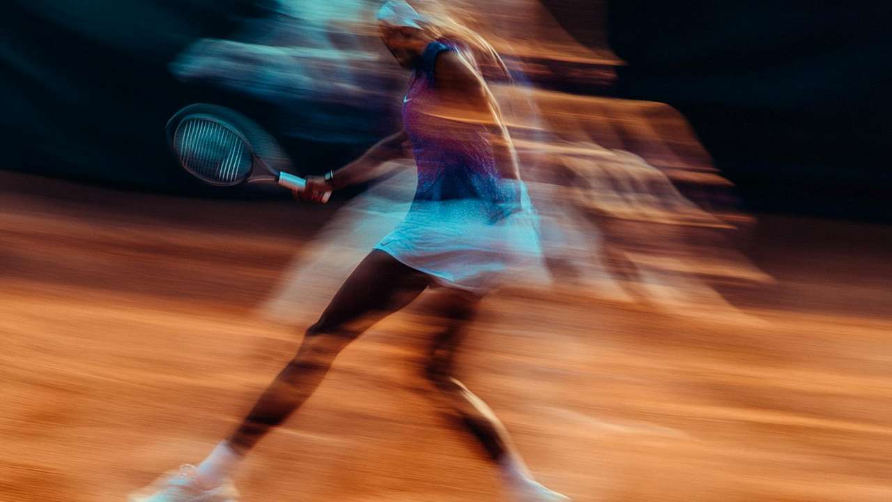 Dynamic motion capture of a tennis player on a clay court.
