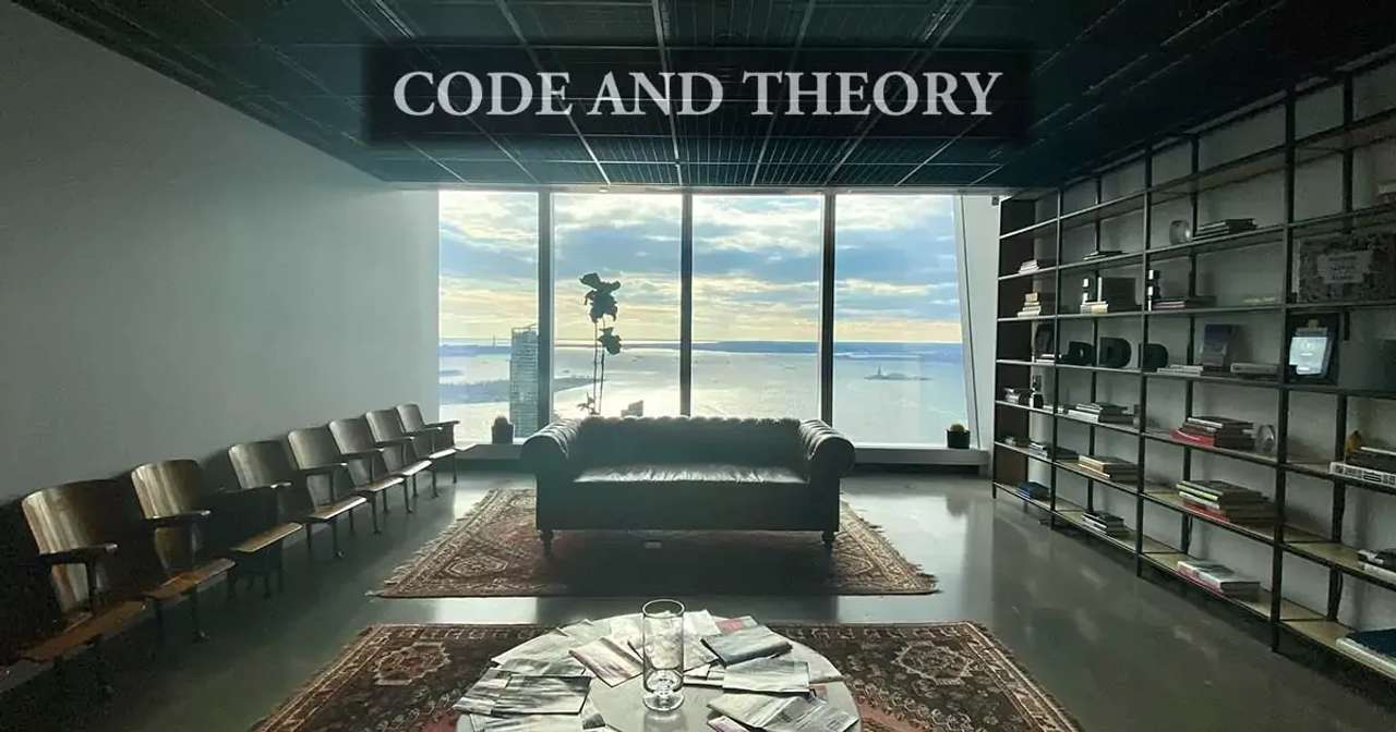 Office interior with a large window view, leather couch, and bookshelves.