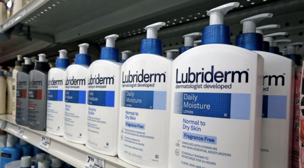 Shelf display of Lubriderm Daily Moisture lotion bottles.