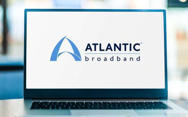 Laptop displaying the Atlantic Broadband logo on the screen.