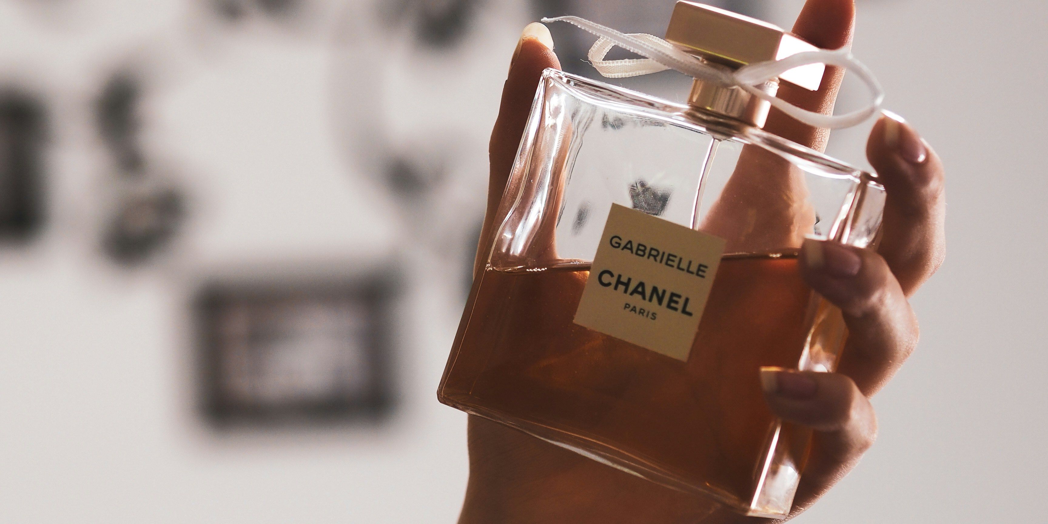 hand holding perfume bottle