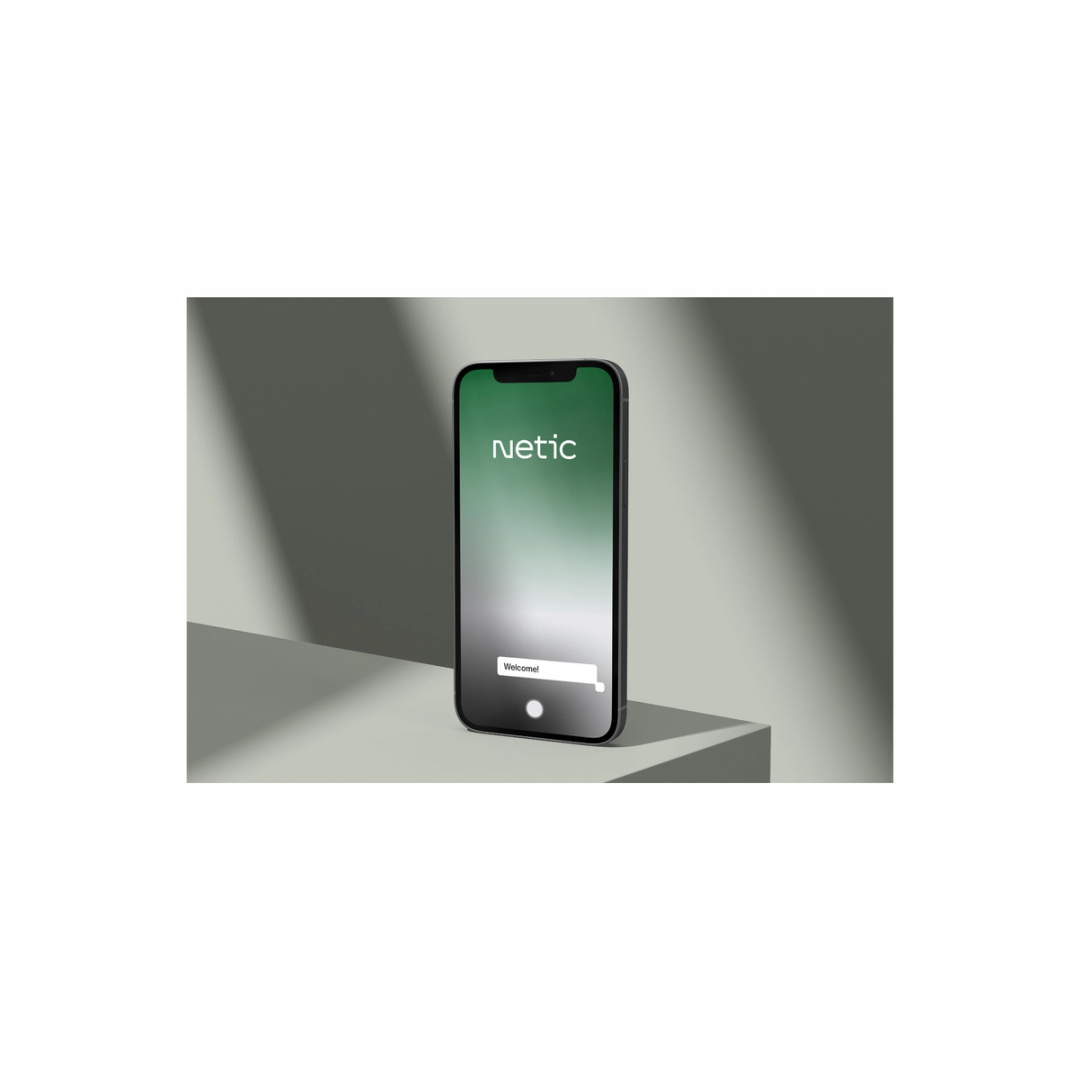 Phone displaying Netic’s green login screen.