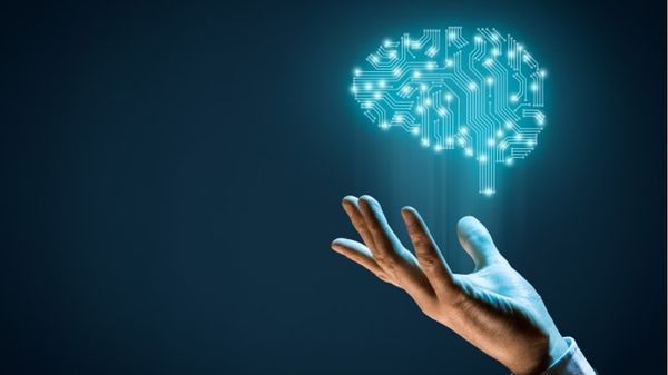 Hand with artificial/computational brain floating above it