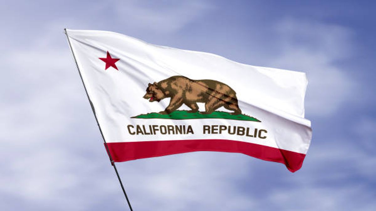 California Flag flying against cloudy sky 