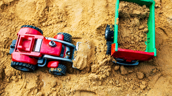 Sandbox with two trucks