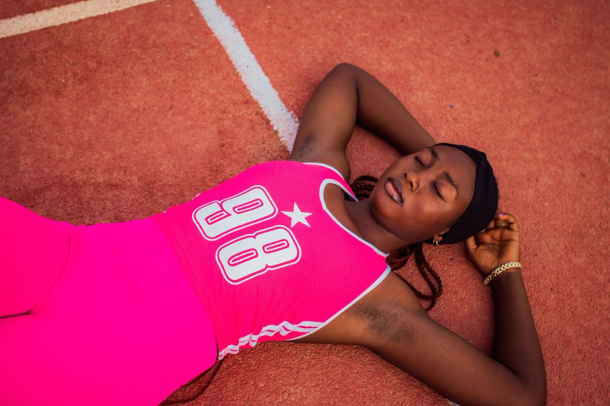 Athlete resting on running track