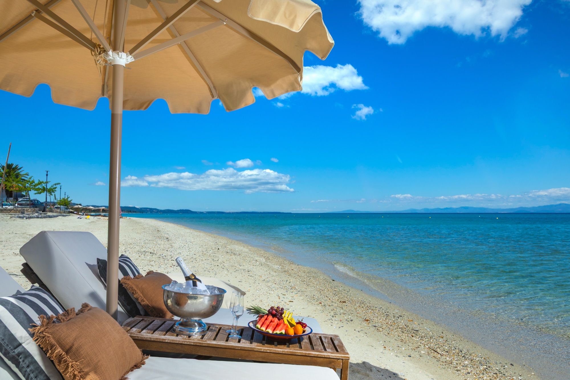 Champagne and fruit service on sun loungers