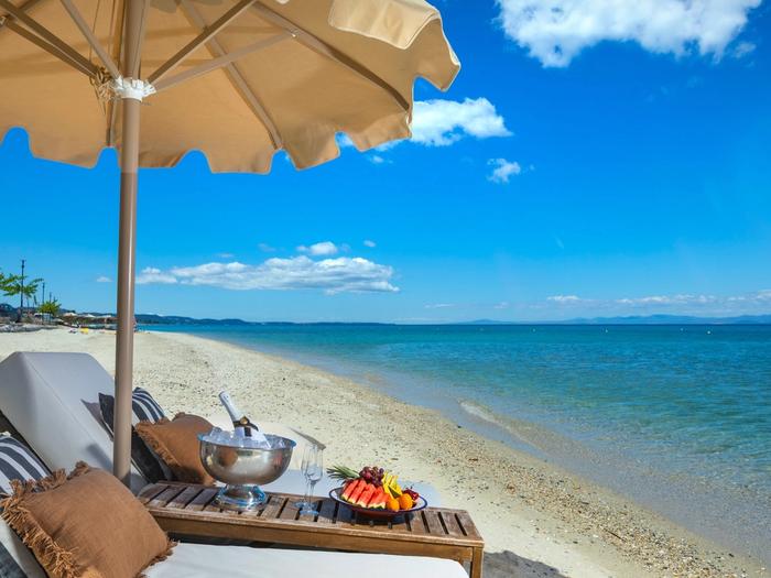 Champagne and fruit service on sun loungers