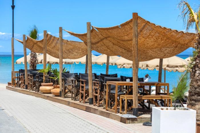 Shaded dining area at A.bar by the shore