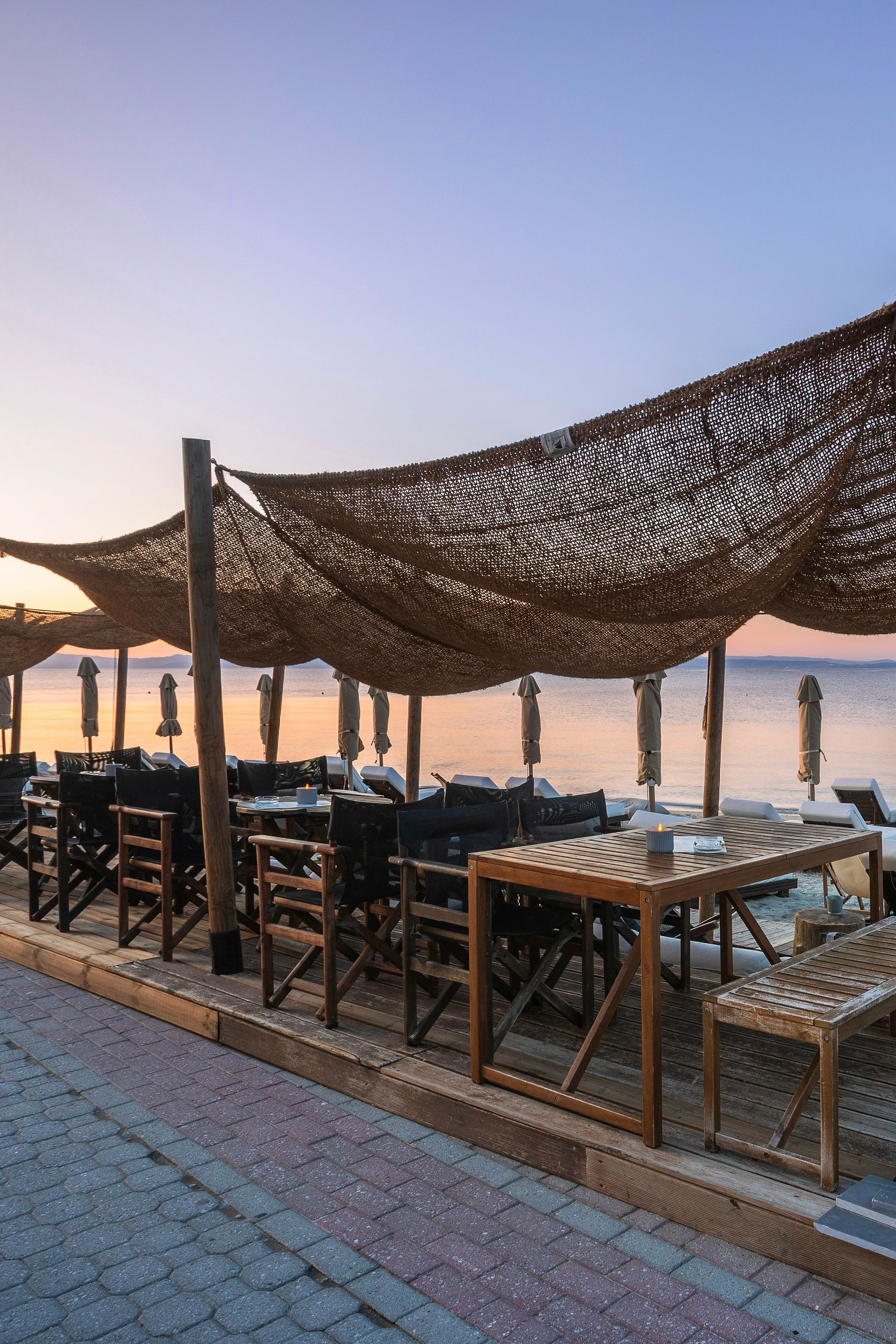 Wide beachfront view with A.bar shade structures