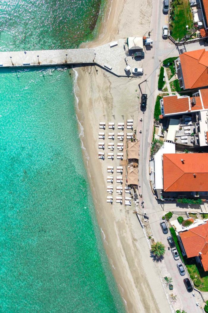Aerial view of beach umbrellas and the pier