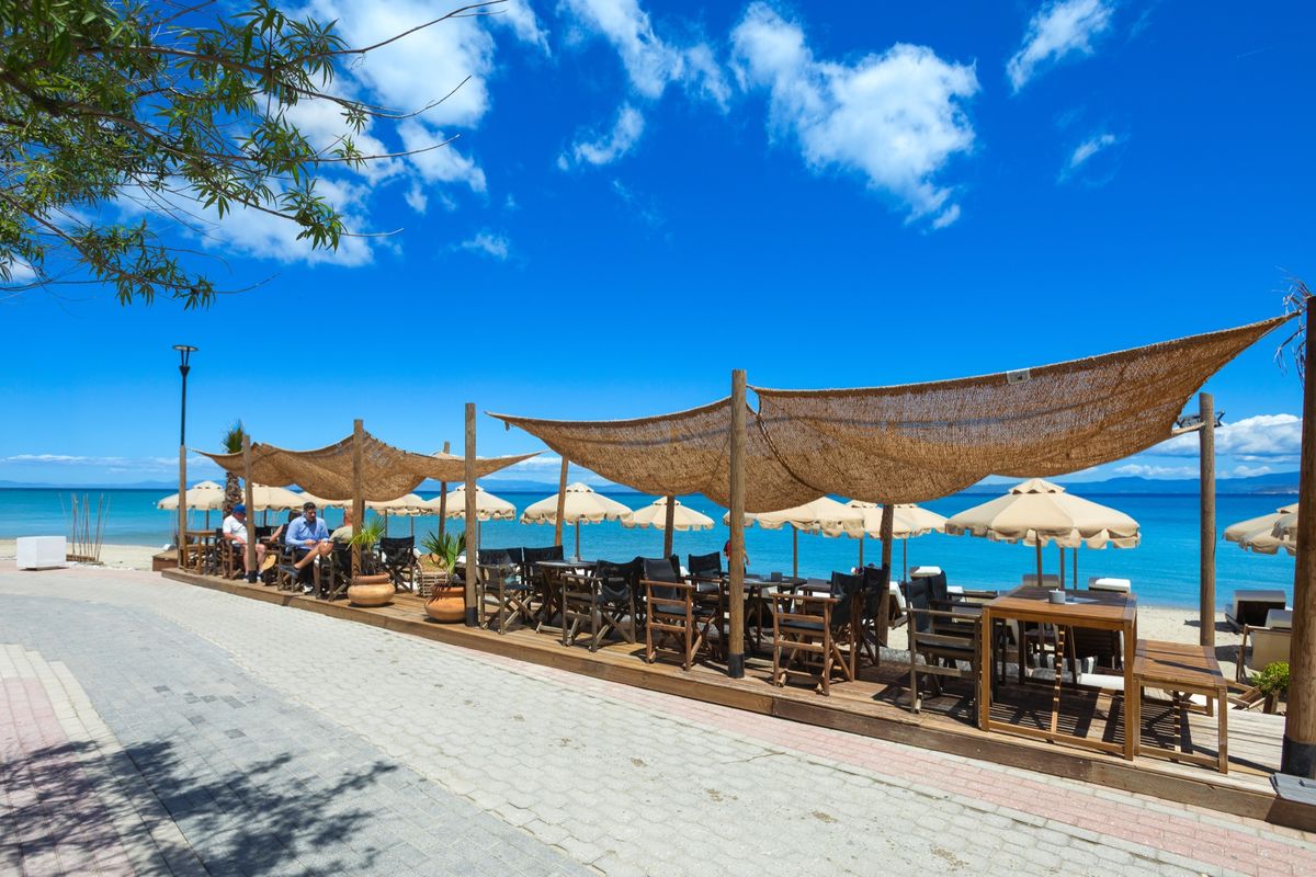 Outdoor seating at A.bar overlooking the Aegean