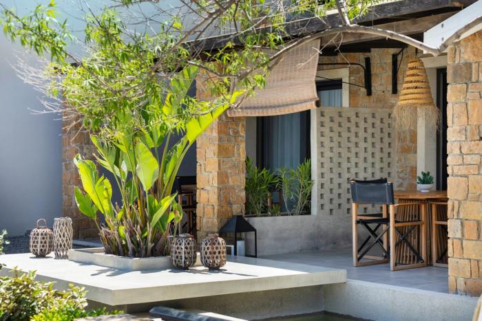 Stone patio with woven pendant lights