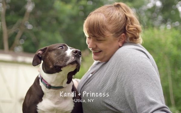 Woman smiling at a dog named Princess in Utica, New York.