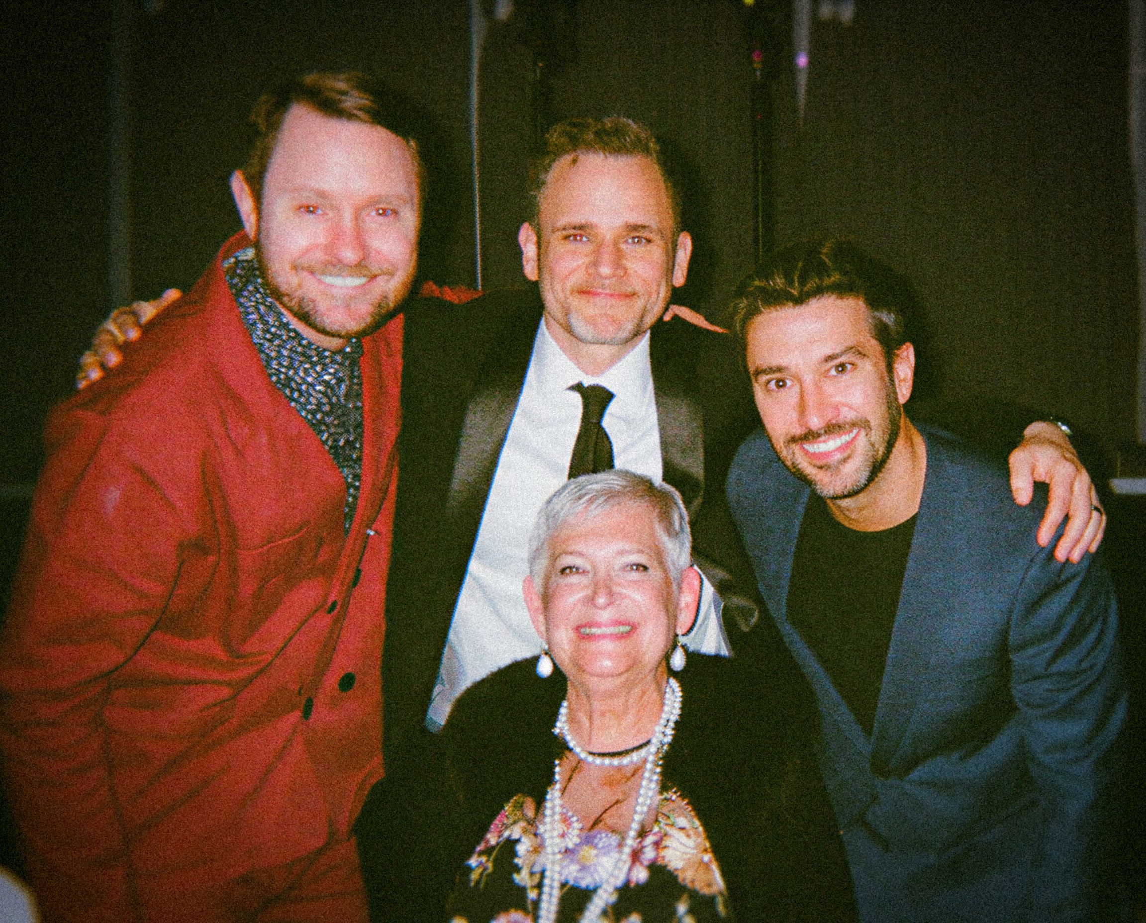 Creative agency team members posing together during an industry awards and recognition event.
