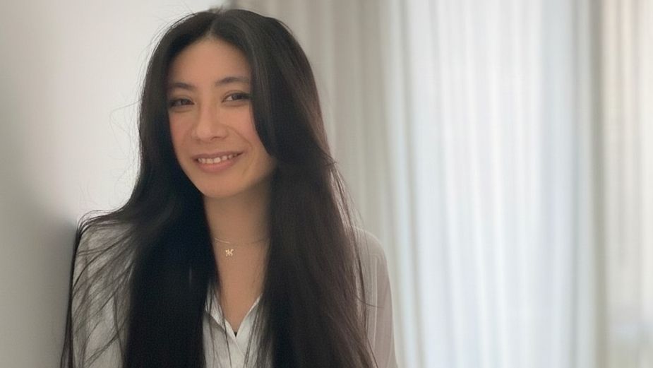 Portrait of Tina Lam, a Terri & Sandy team member, smiling in a light-colored blouse.