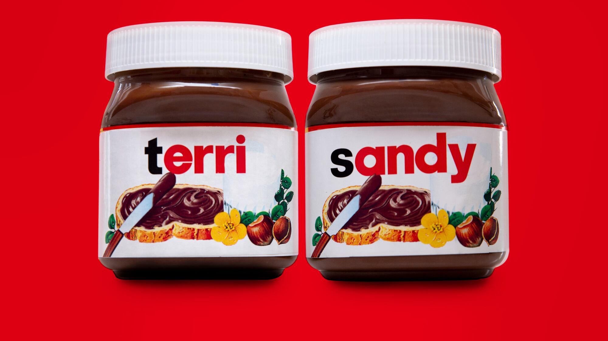 Two jars of Terri & Sandy-branded Nutella chocolate hazelnut spread against a red background.
