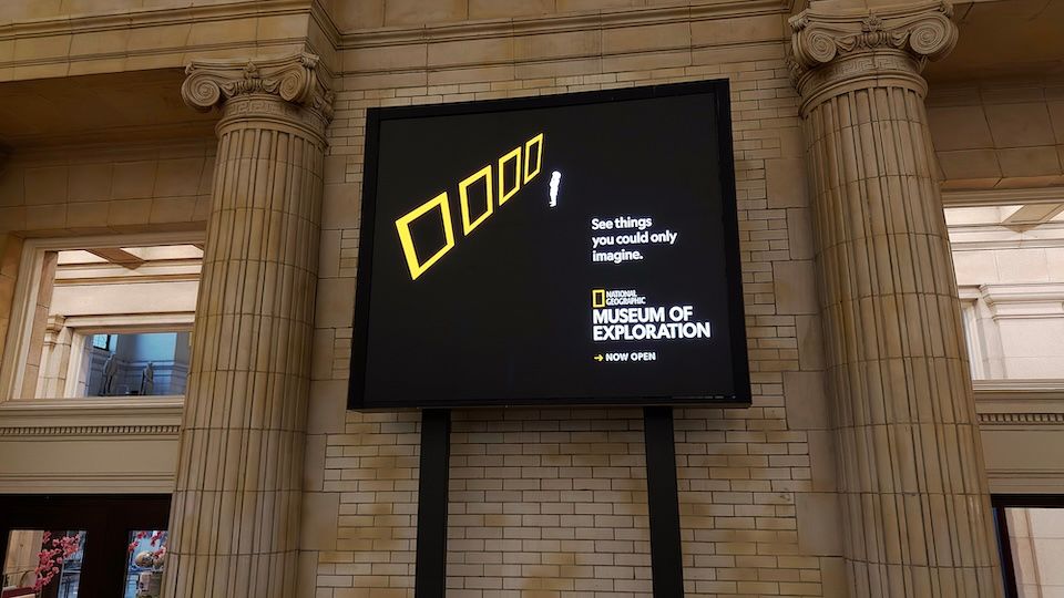 National Geographic Museum of Exploration advertisement featuring yellow frames and the message “See things you could only imagine.”