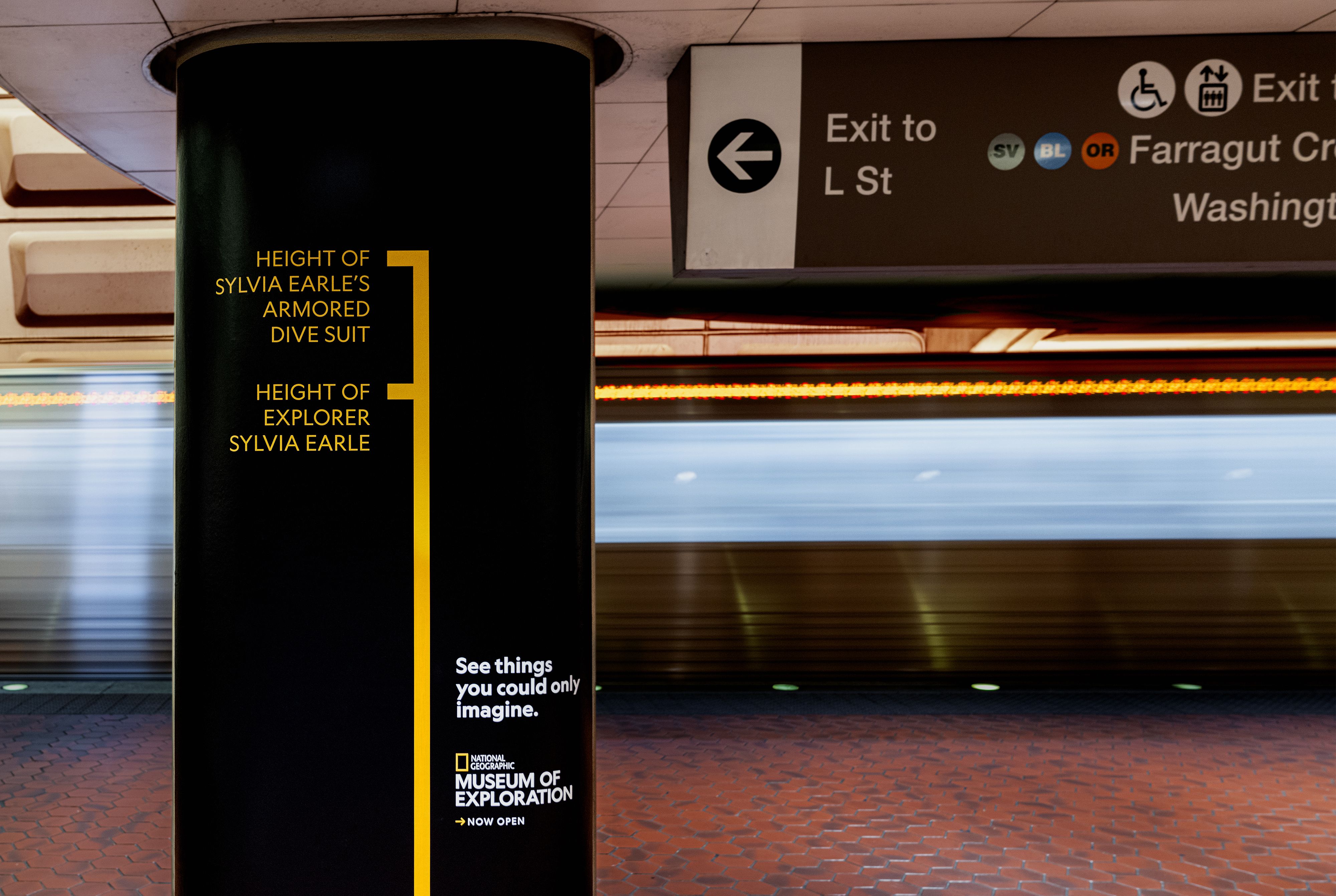 National Geographic Museum of Exploration subway ad comparing the height of Sylvia Earle’s armored dive suit with the ocean explorer.