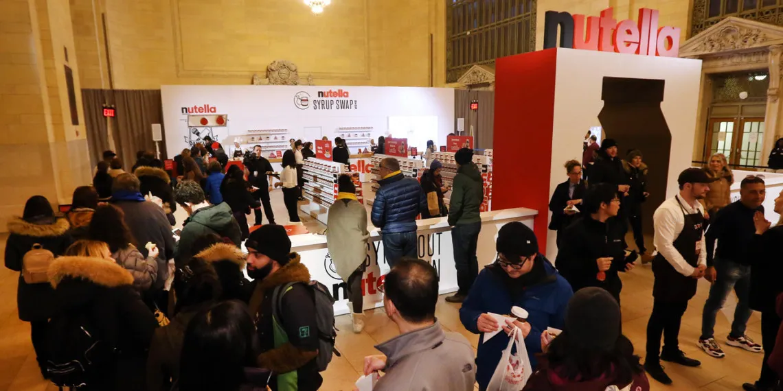 Guests explore the Nutella Syrup Swap promotional activation at an indoor event.