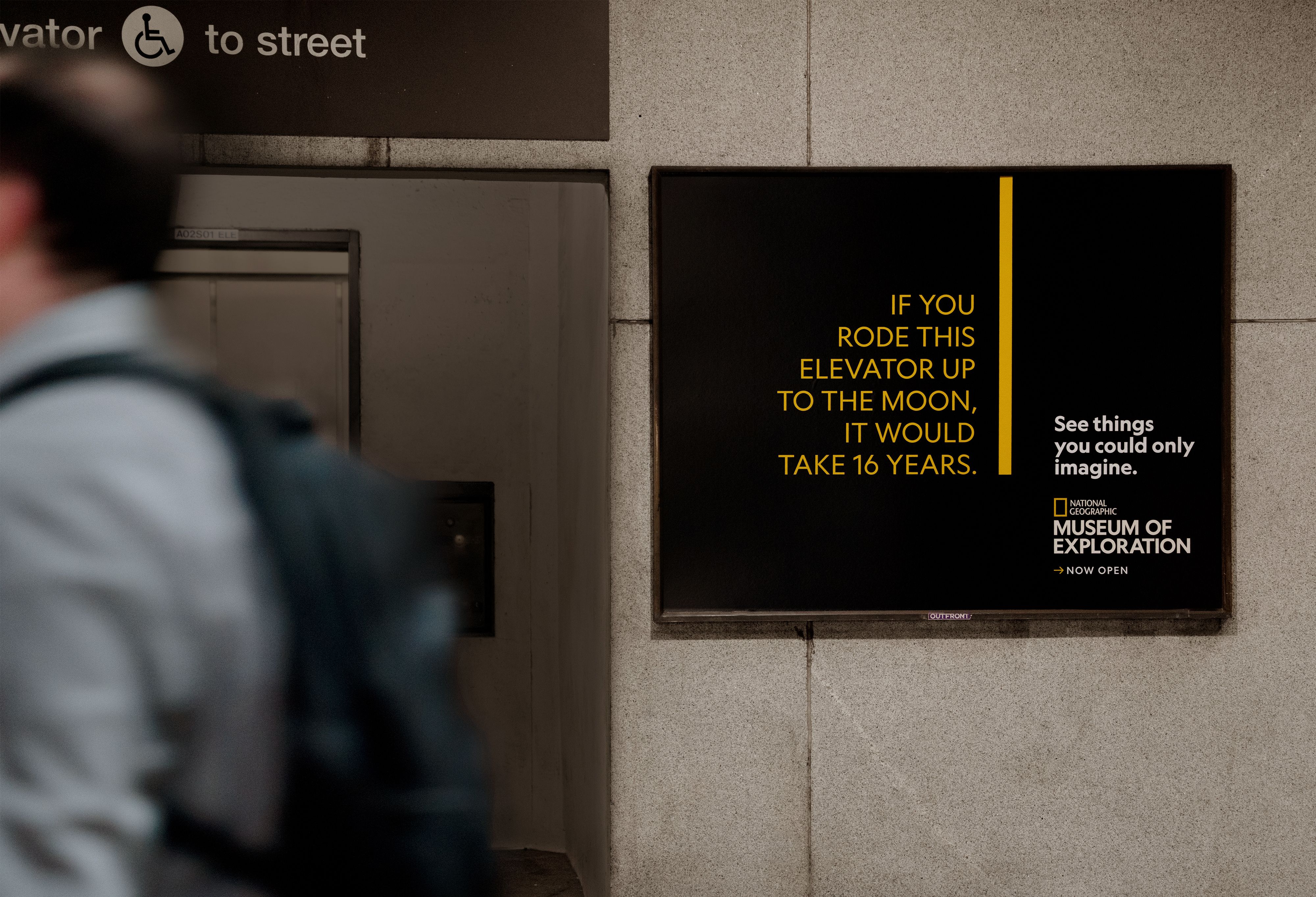 National Geographic Museum of Exploration transit ad explaining that riding an elevator to the moon would take 16 years.