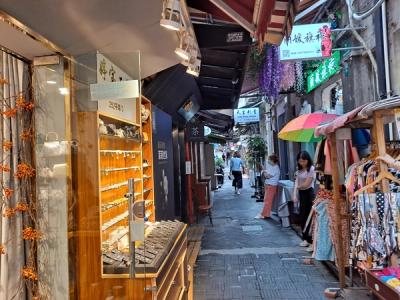 A narrow lane in Tianzifang lined with small shops and clothing stalls