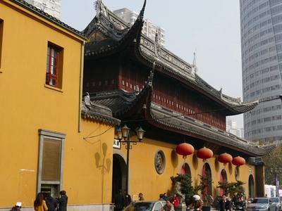 The yellow walls and curved roofs of the Jade Buddha Temple on Anyuan Road, hung with red lanterns