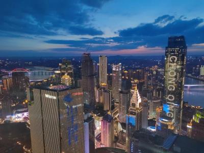 Chongqing's illuminated skyline at dusk, seen from above the Yuzhong peninsula