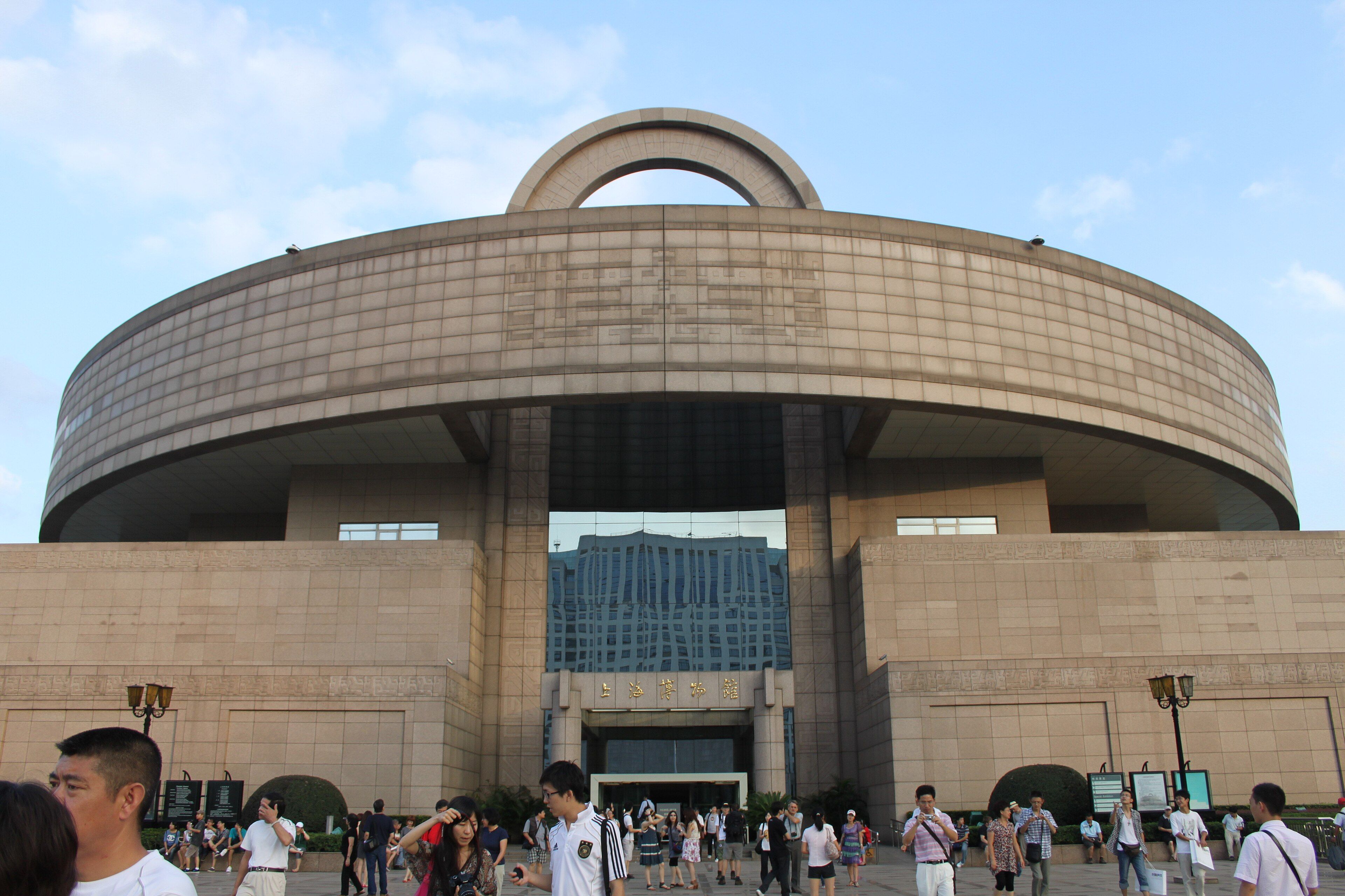 The round, bronze-vessel-shaped Shanghai Museum building on People's Square