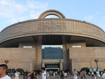 The round, bronze-vessel-shaped Shanghai Museum building on People's Square