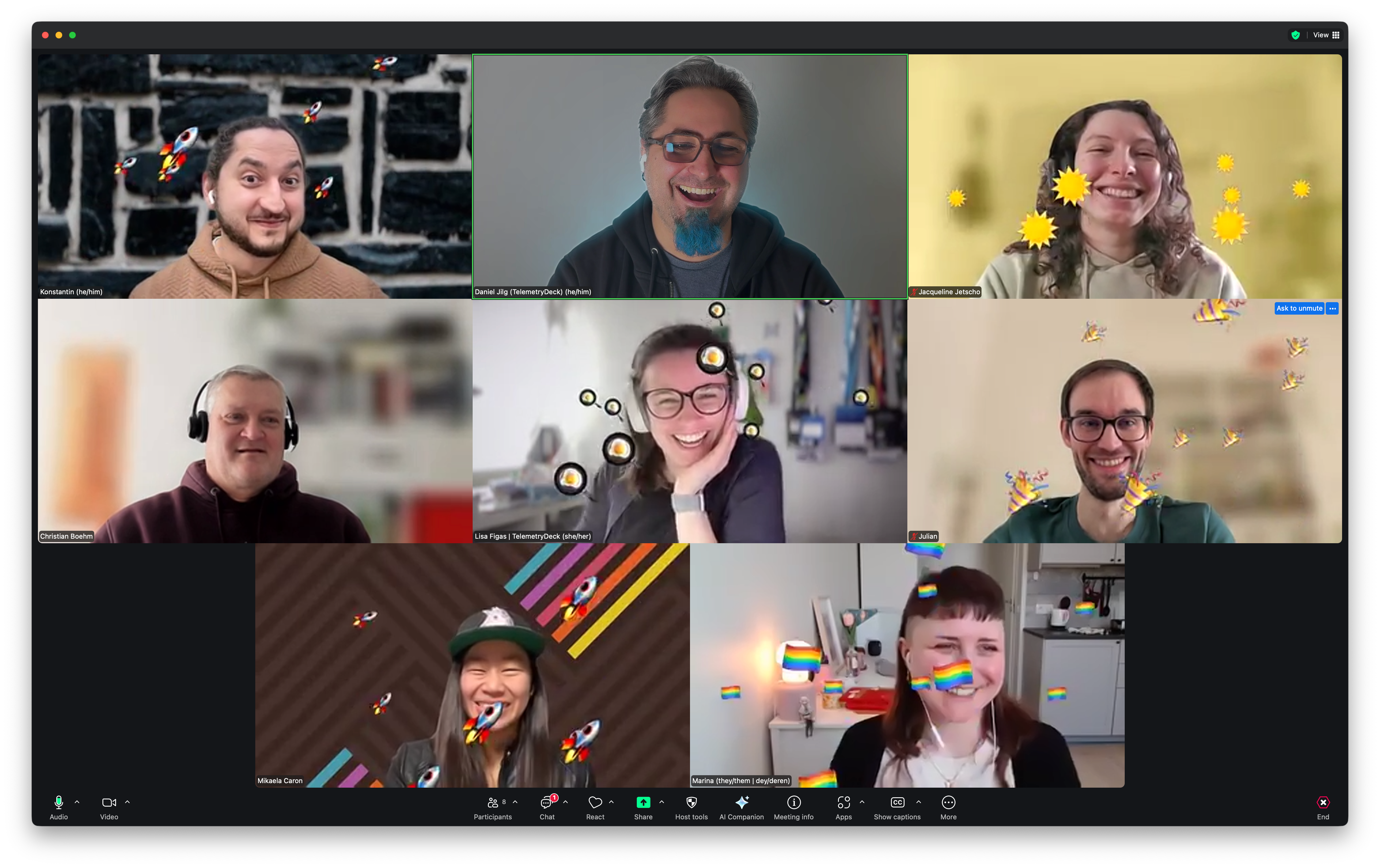 Screenshot from a team meeting with 8 smiling people.