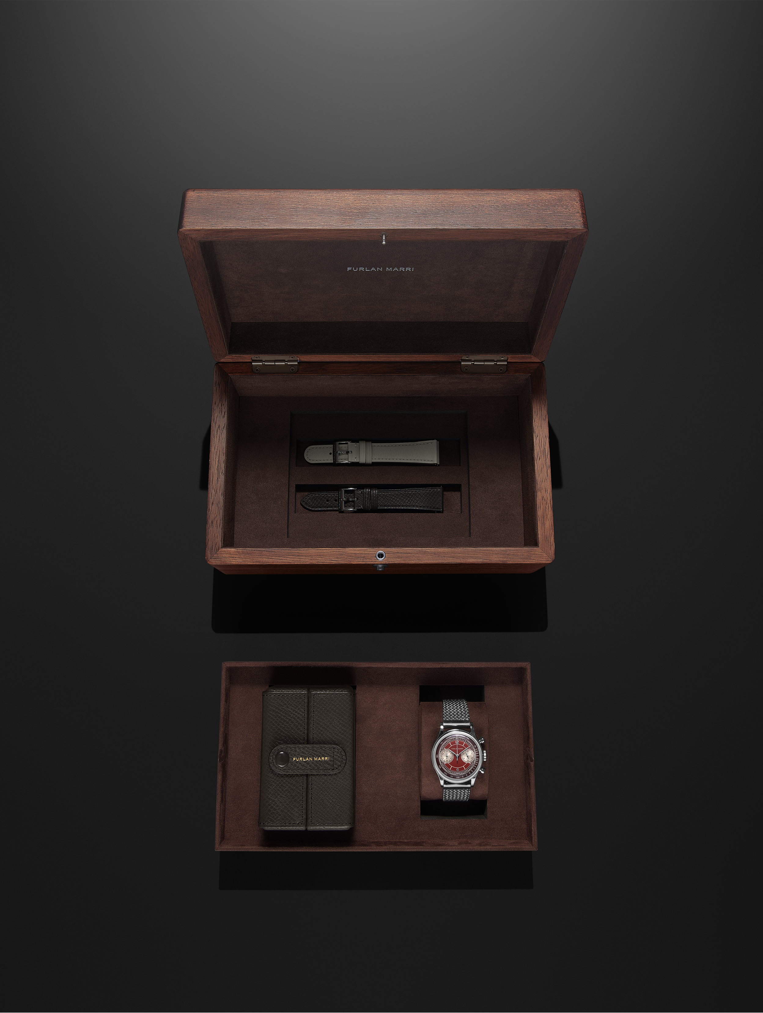 A Furlan Marri wooden box including the Mechaquartz "Prototype" Case N°00 with two leather straps and 1 travel box. Auctioned at Marteau & Co for The Heat Wave