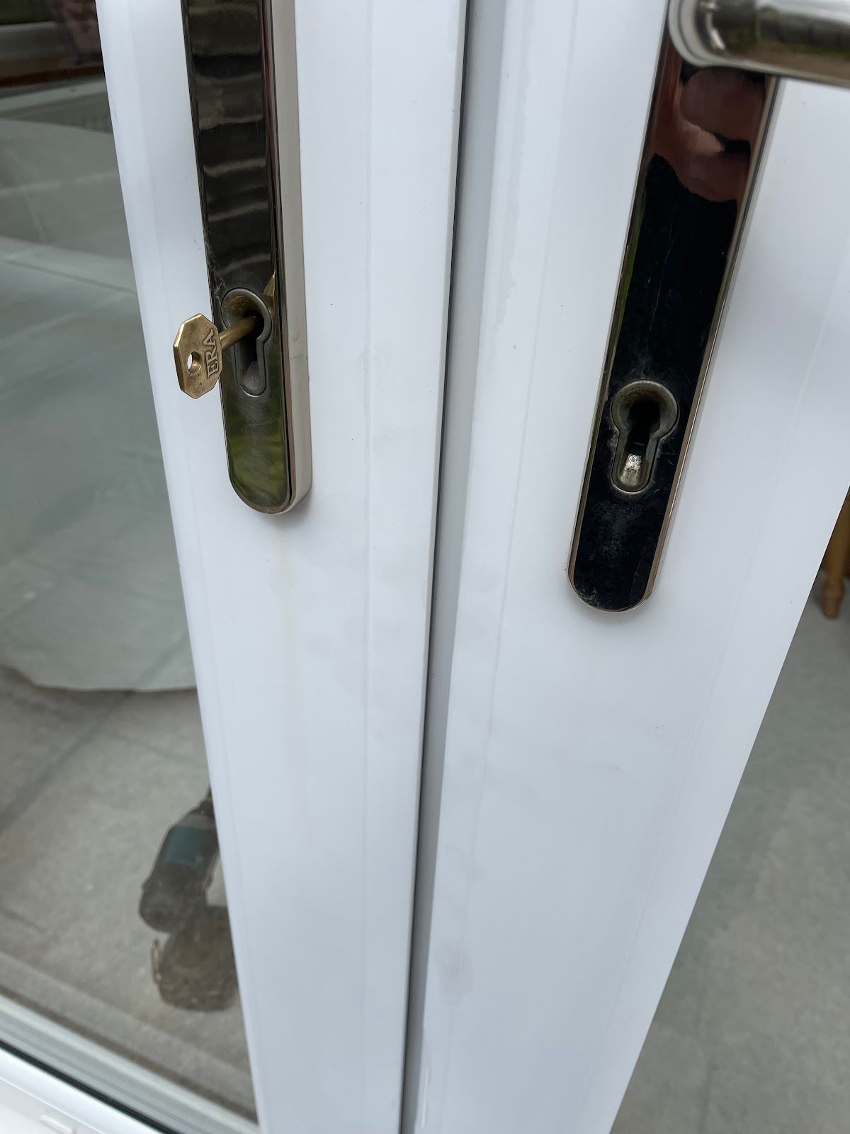 uPVC multipoint locking mechanism with key inserted, showing the type of euro cylinder that can be vulnerable to snapping