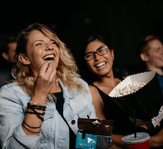 woman laughing at the cinema